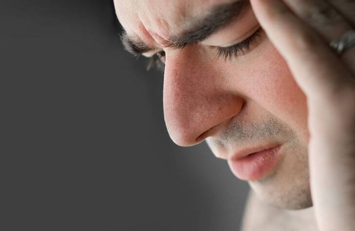 A man suffering from a headache