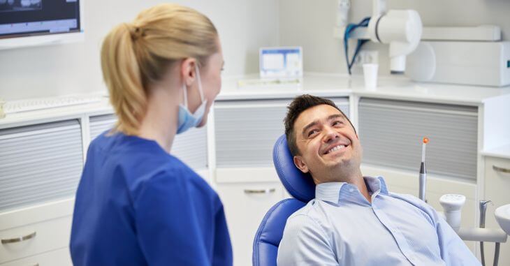 A satisfied man in a dental chair after a routine checkup 